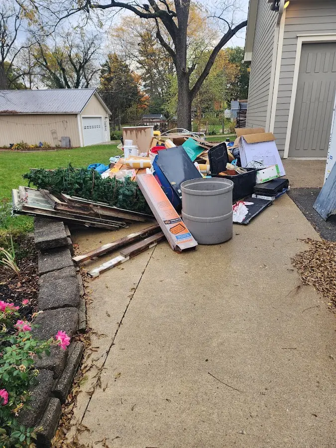 Dumpster being loaded with debris for 3 Yard Dumpster Rental in Weatherford